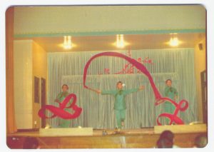 vintage photo of three dancers performing Chinese red ribbon dance