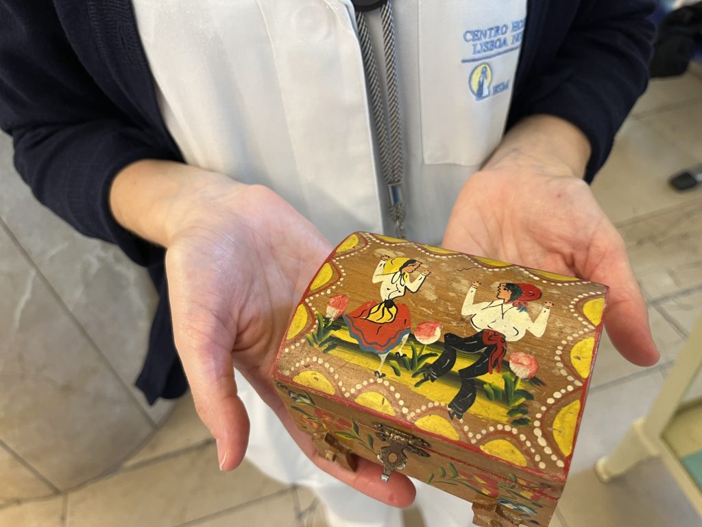 Young Asian woman pictured with the 1964 World's Fair Unisphere in Queens, NY
